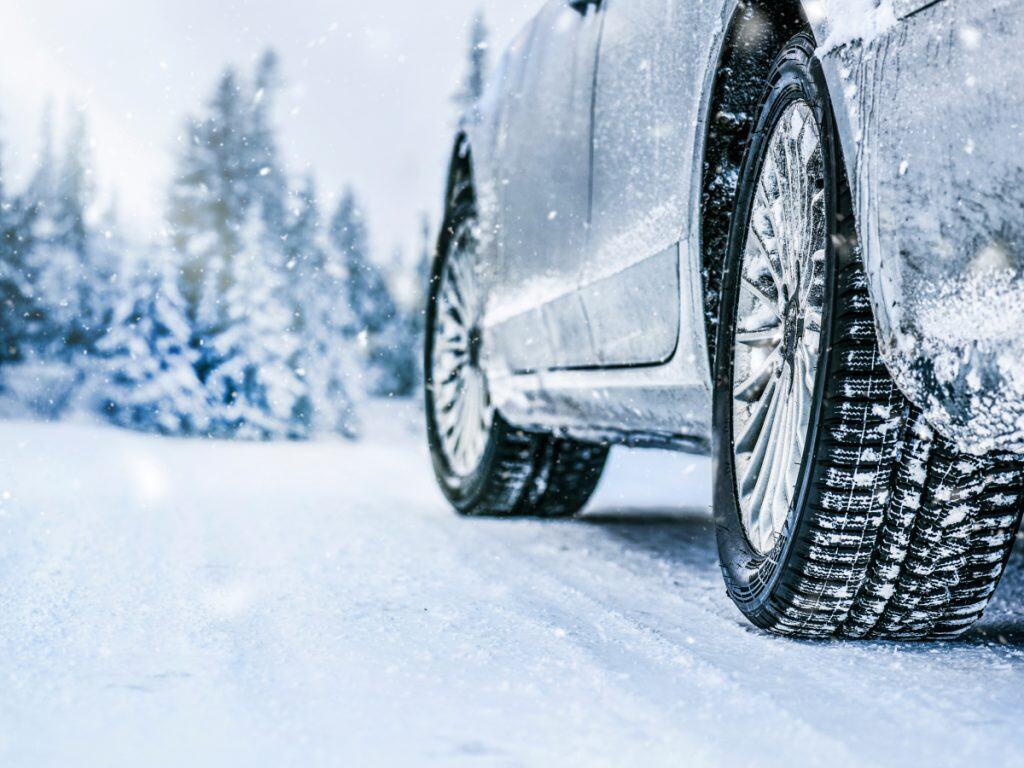Applying an even film of liquid ice melt with a sprayer